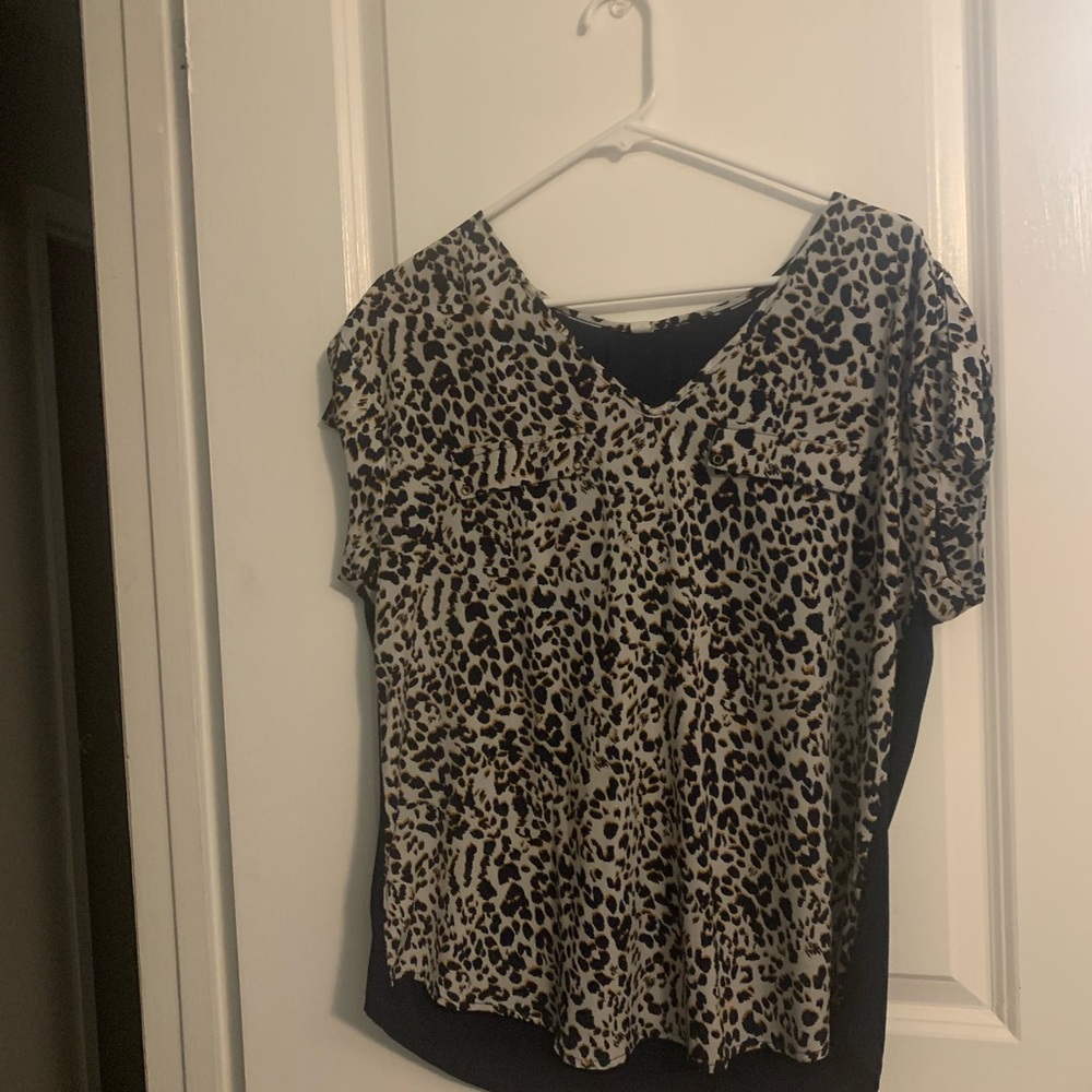 V neck Leopard print Blouse is size L tied sleeves and 2 faux pocket flaps.
